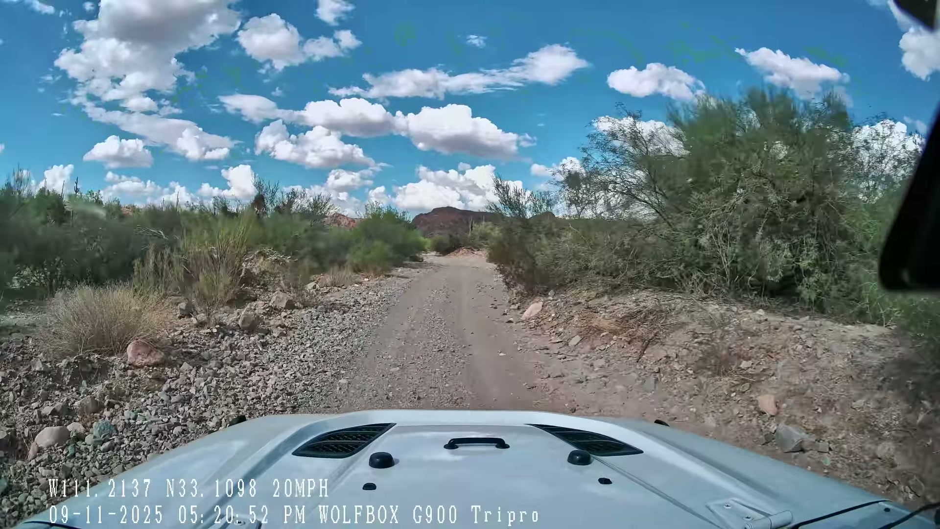 Jeep navigating rock obstacles on the trail
